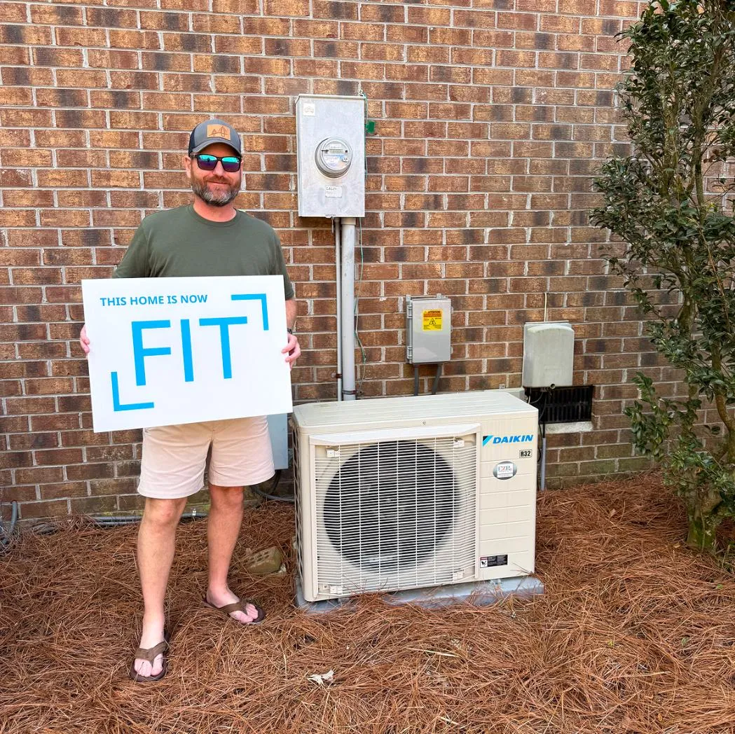 Homeowner with newly installed HVAC unit
